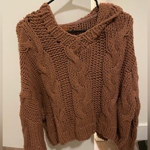 Boutique sweater with hood in a rust color